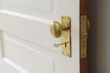 A brass doorknob paired with a mortice lock is a quintessential vintage look.