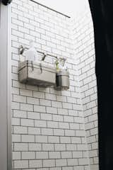 Bath Room, Vinyl Floor, One Piece Toilet, Ceiling Lighting, Full Shower, and Subway Tile Wall The shower is our favorite part of our bus. It’s topped with a clear sky light allowing lots of light in and showers underneath the stars.  Photo 3 of 9 in Blue Steel, Our Self Coverted School Bus Tiny Home by Ashley