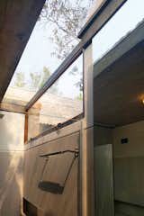 Bath Room, Corner Shower, Concrete Wall, and Ceramic Tile Wall  Photo 8 of 12 in LHTE Guest Bungalow Extension by SILT