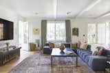 The giant family room includes a built in wallpapered two sided hutch/pantry and french doors that lead to a perfectly landscaped, grassy backyard. Farrow & Ball Paint. Design by Nickey Kehoe. +COOP decor.