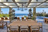 An entertainer's dream, the resort-style grounds include a covered open air pavilion w/fireplace, al fresco kitchen w/pizza oven, grill & 2-stone-crafted bars that flows to a 70'x25' ocean view pool w/spa, sunken lounge area, pool bath, & fire pit.