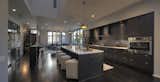 We love the hair on hide stools from LEE Industries to add texture to this industrial kitchen. 