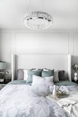 The master bedroom needed to feel like a retreat, keeping the light and airy feeling from the public living space. The headboard was placed against a long wall and so we defined the space using wall mouldings. 