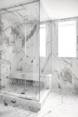 The smaller steam shower displays the dramatic veining of the porcelain marble tile perfectly. 