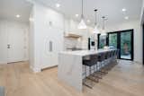 Beautifully Appointed Kitchen Leading Outside and to Dining Area