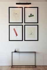 The living room displays prints by artist Richard Vergez.
