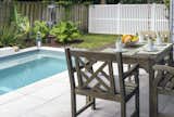 Outdoor, Concrete Pools, Tubs, Shower, Hot Tub Pools, Tubs, Shower, Shrubs, Pavers Patio, Porch, Deck, Wood Fences, Wall, Plunge Pools, Tubs, Shower, Small Pools, Tubs, Shower, Hardscapes, Back Yard, Grass, Concrete Patio, Porch, Deck, Small Patio, Porch, Deck, Concrete Fences, Wall, and Vertical Fences, Wall  Photo 11 of 14 in Paradise Preserve | Atlantic Beach Contemporary Backyard by Cascade Outdoor Design