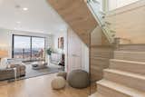 New oak stair and open glass railing was created to connect the two living floors with family room on first floor and open living/dining/kitchen on second floor