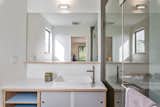 Custom vanities and tile inspired by classic mid-century materials.