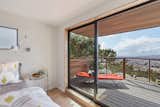 Master bedroom opens into expansive deck with westerly views of Pacific Ocean