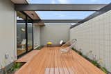Font entry courtyard with new deck and landscaping adjacent to dining room