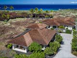 Exterior, Stone Siding Material, Shingles Roof Material, Stucco Siding Material, Hipped RoofLine, Wood Siding Material, and Beach House Building Type Aerial View  Photo 1 of 34 in Manini`owali Villa 5 by Sunnland Architects
