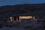 Exterior, Metal Siding Material, Flat RoofLine, Metal Roof Material, House Building Type, and Concrete Siding Material twilight/environment image  Photo 4 of 12 in The Arroyo House by stephen morgan photography