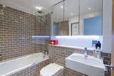 Streamlined, and well-lit, the bathroom is ideally suited to modern life.