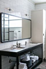 Bath Room, Freestanding Tub, Porcelain Tile Wall, Pendant Lighting, Granite Counter, and Drop In Sink  Photo 13 of 17 in SEI Live/Work by Serenbe 
