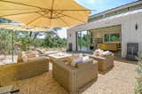 Restoration Hardware outdoor seating, water features and fire table provide the outdoor in the indoor/outdoor living area that benefits from a 16’ wide and 9’ tall pocketing doors
