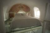 The sleeping quarters are on the loft. This is the double bed area with its own fresco.