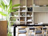 Detailing for the open shelves next to dining area allows for the interplay of light and shadow.