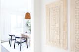 In the studio's entrance, Mexican handmade amate paper hangs organically and creates a patterned shadow effect.