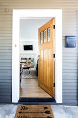 Exterior, Wood Siding Material, and House Building Type In a nod to it's craftsman roots, the 1980s front door was replaced   Photo 7 of 8 in Resurrected Craftsman Residence by Samira Mahjoub Tapia