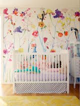 Bright colors, soft light, and simple features create a peaceful nursery space. 