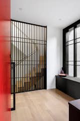 This new home nestles amongst the trees of a watershed to take advantage of smaller moments of privacy in an otherwise urban environment. Mid-century lines divide airy interior volumes anchored by a concrete garage. Using screens and sliding doors to create spaces that can transform based upon need.