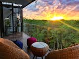 A spiral staircase leads to the private rooftop suite and pool.