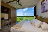 The master bedroom has a view of Tulum's Mayan Ruins, which can be seen from the bed.