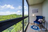 A reading nook in the guest bedroom offers a direct view of Tulum's Mayan Ruins.