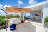 The rooftop suite is partitioned with folding accordion doors that extend the living space into the roof and pool area.