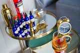 Guests have access to a home bar that includes a selection of bitters, liqueurs, and bar tools.