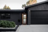 Clean lines and a sleek black exterior welcome you to this North Highland Park hilltop home.