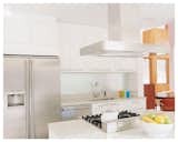 The bright white kitchen opens to the Dining and the Sunroom (not shown).