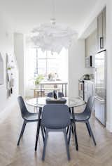 DINING SPACE UPGRADE: A SALMI glass table gets a fresh new look by powder coating the chrome table base navy blue. Complementing the new blue tones with dark ODGER dining chairs, a design that is both sustainable and beautiful.
