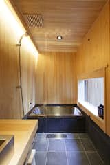 Bath Room, Stone Counter, Ceramic Tile Floor, Wall Lighting, Open Shower, and Tile Counter bath with Japanese "HINOKI" wall  Photo 5 of 17 in My Kyoto Town House by Shinichi Osawa