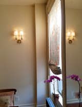 New dining area's wall sconces and Chinoiserie fabric roman shade
