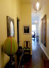 Entryway with new glass globe lighting and wood art panels