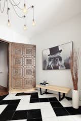 Entrance gallery with black and white marble floor.