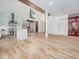 Red doors reclaimed from original 1920s cabin; kitchen features high end stainless steel appliances and beautiful view of the surrounding woods and lake