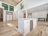 Foyer and great room features 20 foot ceilings. Home has been framed so that additional rooms can be built on either side of foyer and inside foyer on second level if desired.