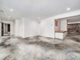 Custom treatment on terrace level flooring - view of flex space that can be used as bedroom, office, wine cellar, media room