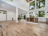 Great room offers spectacular views of lake and woods