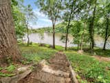 Original stone and concrete steps down to lake date back to 1920s cabin