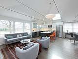 Great Room created by vaulting the, ceiling, adding large 4'x4' skylights and industrial steel structural rods