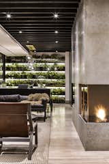 A vertical garden decorates the far end of the dining room.