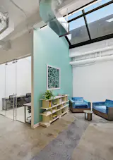 An unexpected reading nook library is tucked away under another sky light in the complex.  We let natural light flood the areas that provide respites from private, closed offices.  When coworkers take breaks from their offices we wanted to ensure that they could get exposure to natural elements and take peaceful breaks to refocus throughout the day. 