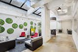 View of the skylight lounge and its green wall panels.