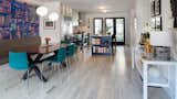 New French doors lead to backyard, built in eating bench and bleached floors