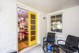 Bright and cheerful seasonal screened porch makes for the perfect breakfast nook.