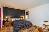 Cloud-like comfort right at home. Live smart in the black and white bedroom with corner windows, solid walnut bed and queen size mattress.